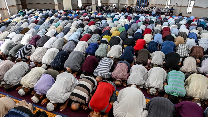 Men are seen praying in the Lakemba Mosque during the Muslim call to pray. Photo taken on October 1 2019