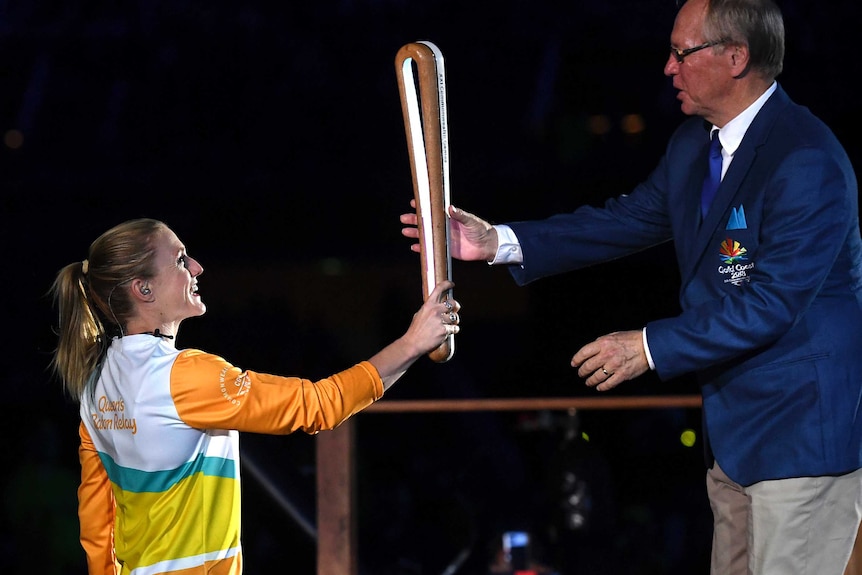 Australian track star Sally Pearson with the Commonwealth Games Queen's Baton during the Gold Coast 2018 opening ceremony.