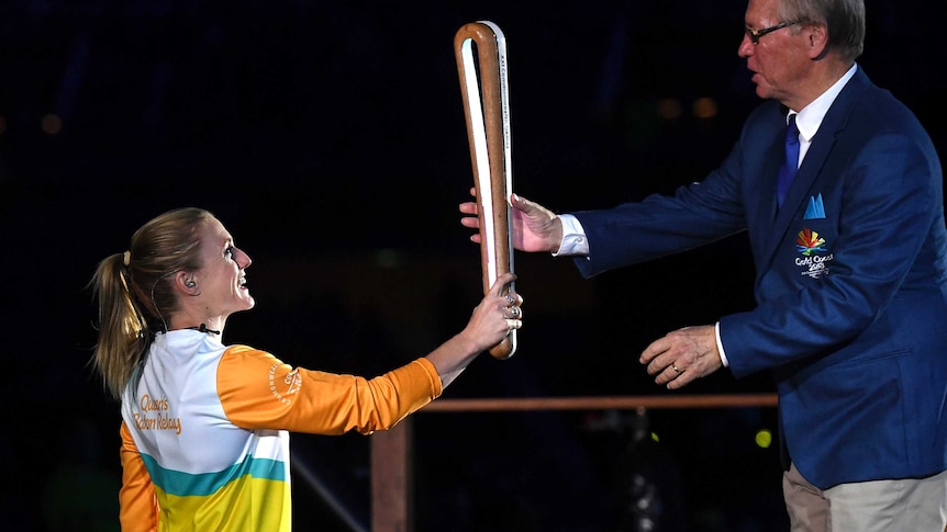 Australian track star Sally Pearson with the Commonwealth Games Queen's Baton during the Gold Coast 2018 opening ceremony.