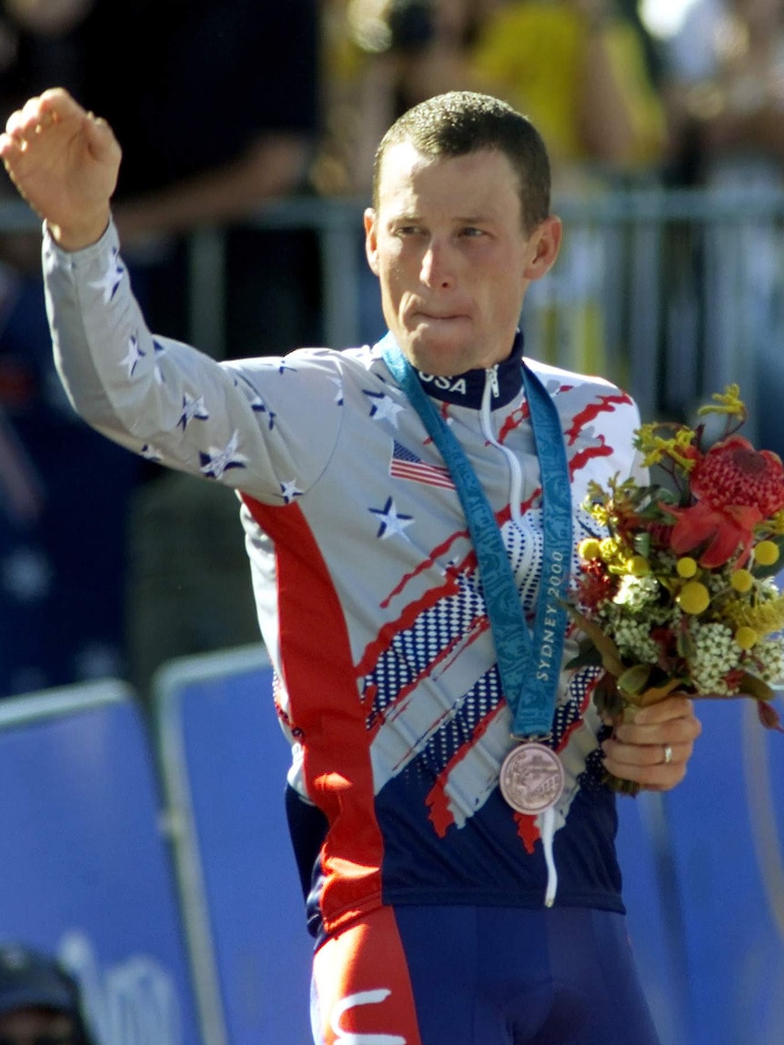 Armstrong hands back Olympic medal