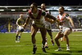 The Dragons' Tyson Frizell scores in the World Club Series match against Warrington.