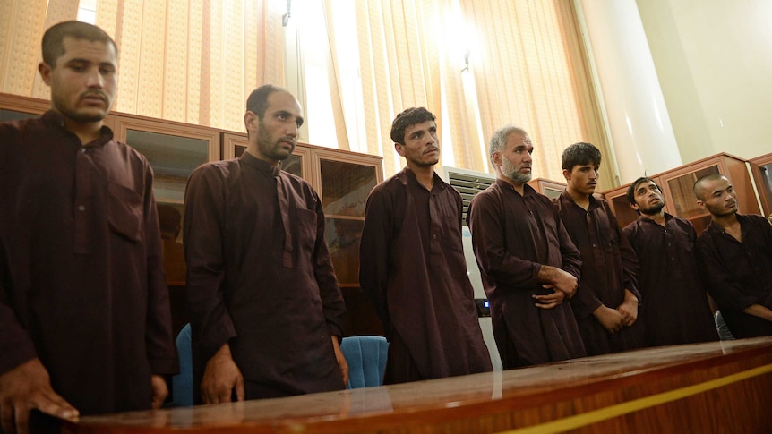 Afghan men convicted of rape standing in court dock