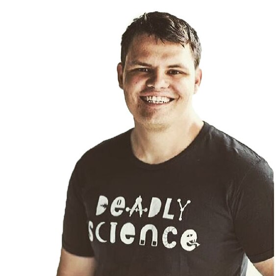 A short haired man aged 30-40 with a t-shirt that says Deadly Science.