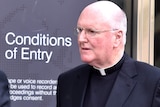 Archbishop Denis Hart leaves the Royal Commission hearing in Melbourne.