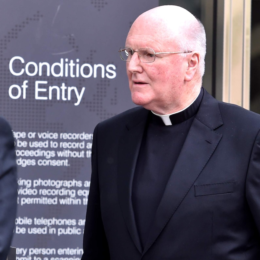 Archbishop Denis Hart leaves the Royal Commission hearing in Melbourne.