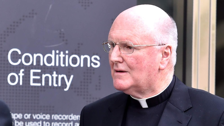 Archbishop Denis Hart leaves the Royal Commission hearing in Melbourne.