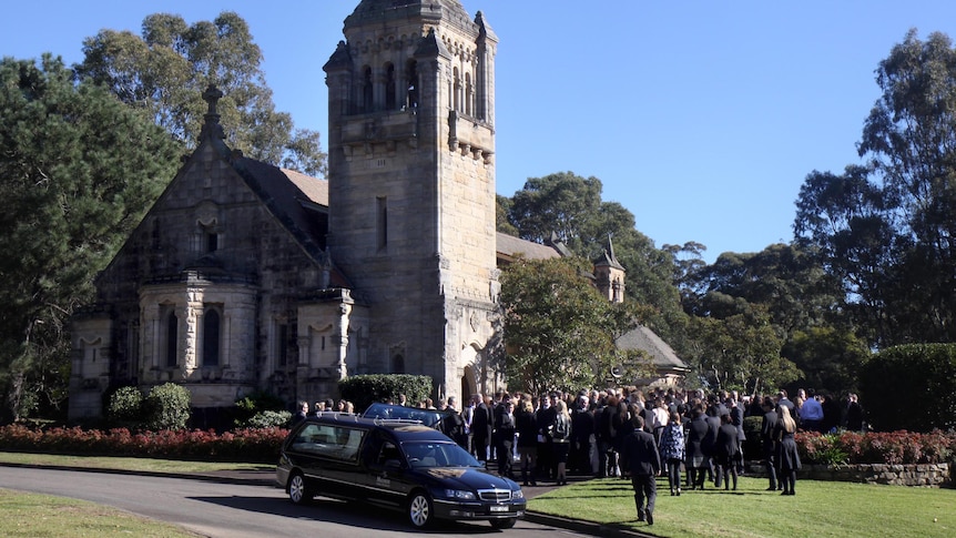 Mourners arrive for the funeral service of Thomas Kelly at Kings College Chapel in Sydney.