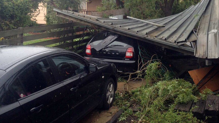 Car crushed under roofing tin at Ararat following a short severe storm on October 22, 2013.