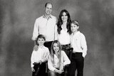 Prince William and Princess Kate post for a photo with their children George, Charlotte and Louis.