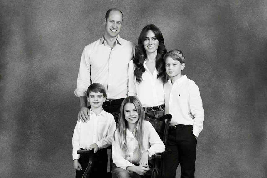 Prince William and Princess Kate post for a photo with their children George, Charlotte and Louis.