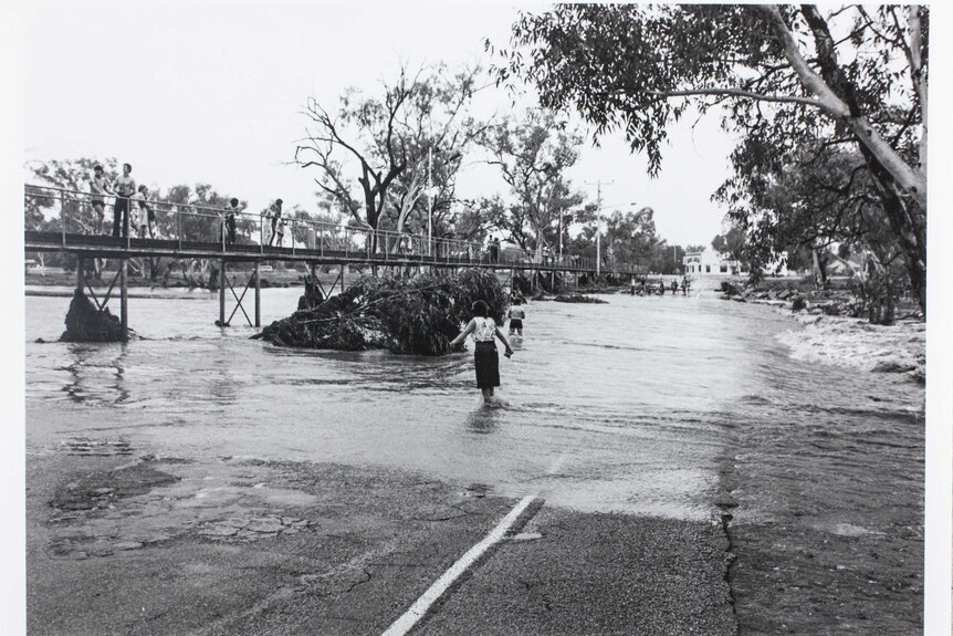 In the days leading up to their visit, the typically dry Todd River had burst its banks.