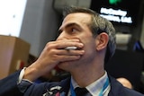 Trader looks stressed during Dow Jones plunge