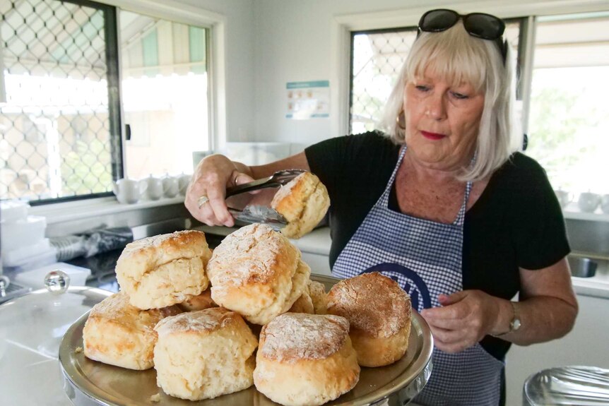 Julia Creek branch president Lyn Clout serves up scones for visitors
