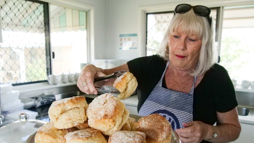 Julia Creek branch president Lyn Clout serves up scones for visitors