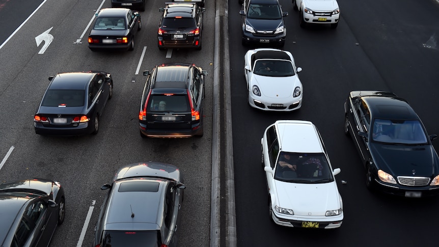 Commuters wait in peak hour traffic in Sydney 