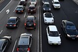 Commuters wait in peak hour traffic in Sydney 