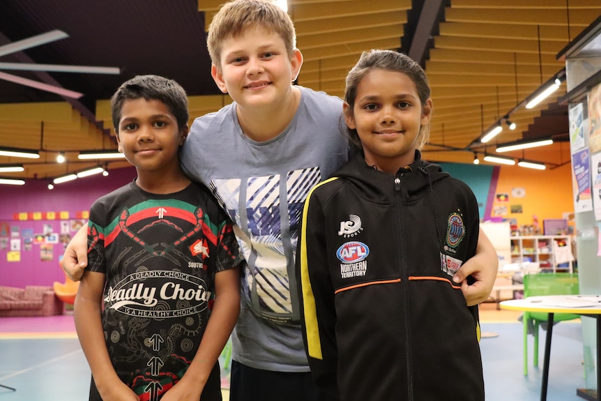 Michael Lacey, Jordan Parfitt and Harmony Lacey look at the camera inside the youth drop-in centre.