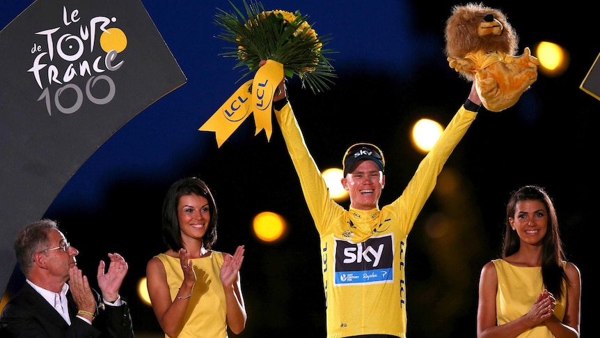 Chris Froome celebrates on the podium after the final stage of the 2013 Tour de France.