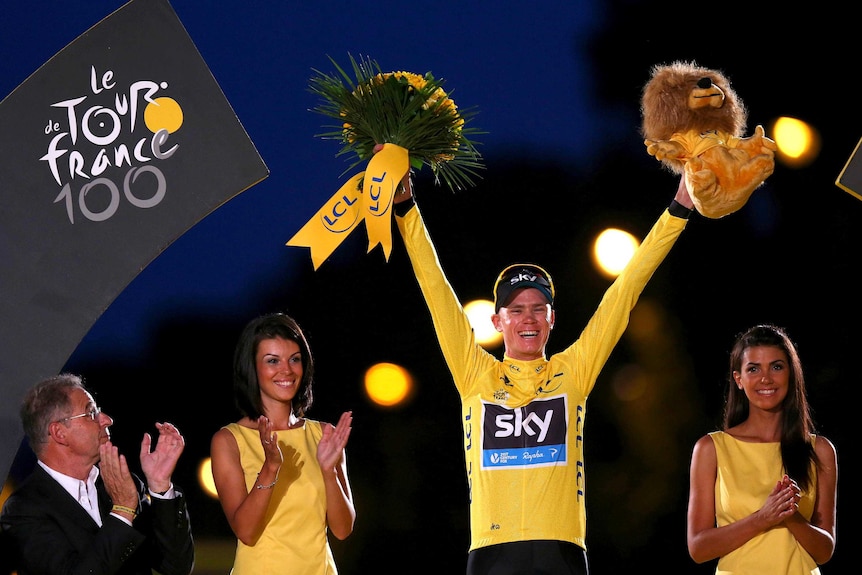 Chris Froome celebrates on the podium after the final stage of the 2013 Tour de France.