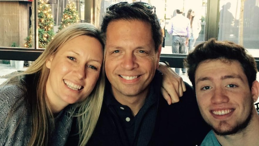 Justine Damond looks happy during a meal with her family
