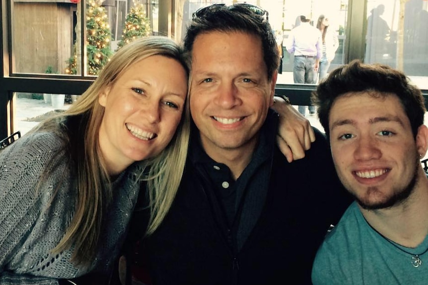 Justine Damond looks happy during a meal with her family