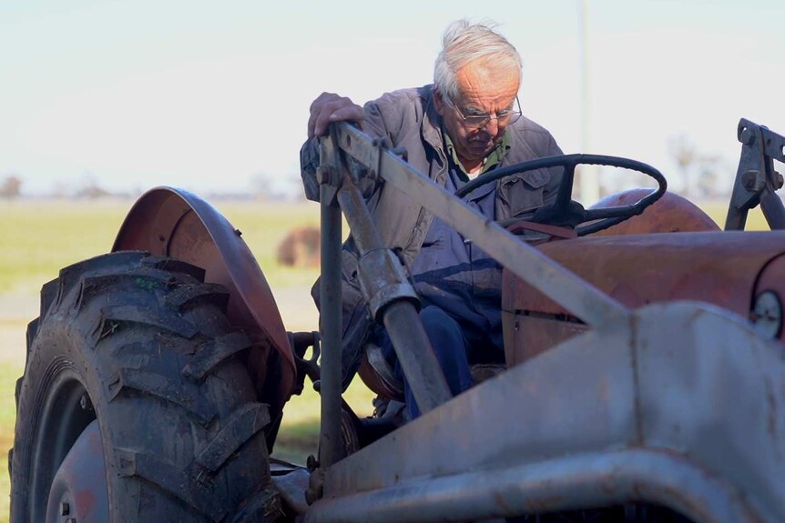 Mechanic Maurice Henry on a tractor