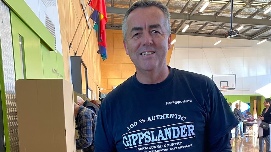 man with top on which says one hundred per cent authentic gippslander 