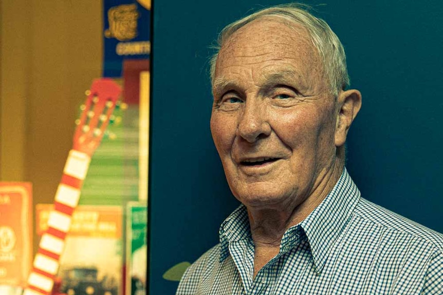 An elderly man stands by an exhibit in the Tamworth hall of fame.