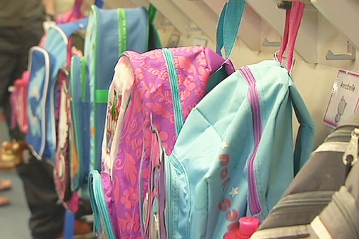 School bags hanging in a row as school starts back for 2014.