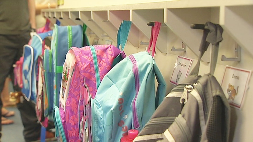 School bags hanging in a row as school starts back for 2014.