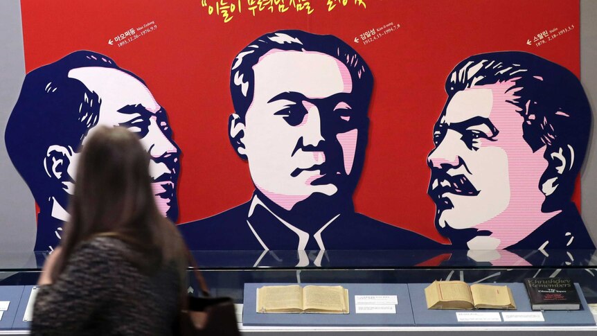 Images of late leaders China's Mao Zedong, North Korea's Kim Il Song and Russia's Joseph Stalin adorn a wall.