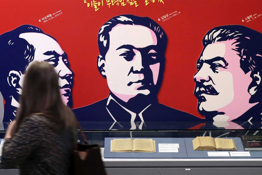 Images of late leaders China's Mao Zedong, North Korea's Kim Il Song and Russia's Joseph Stalin adorn a wall.