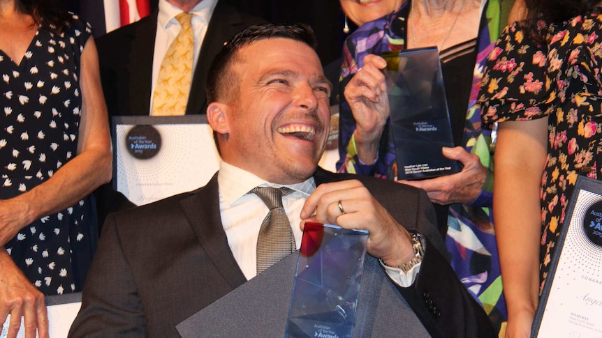 Kurt Fearnley with his award as the NSW Australian of the Year, in Sydney on November 12, 2018.