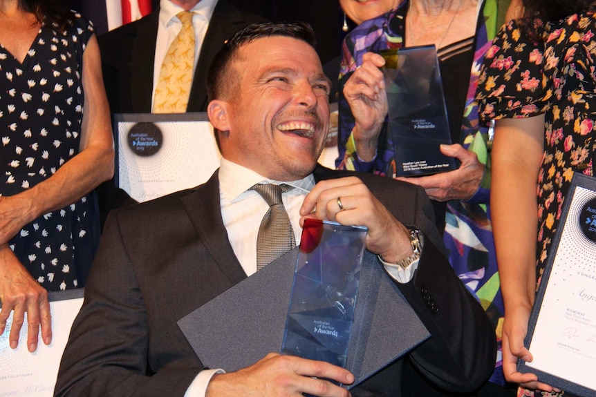 Kurt Fearnley with his award as the NSW Australian of the Year, in Sydney on November 12, 2018.