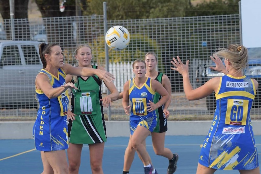 A group of women playing netball.