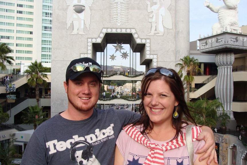 Grant and Beth McEwan stand together smiling while on holidays in the US