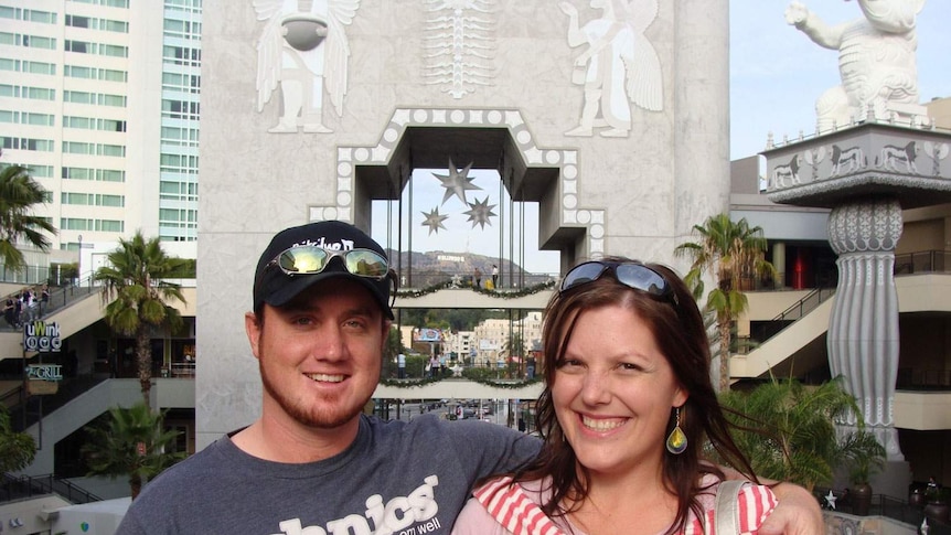 Grant and Beth McEwan stand together smiling while on holidays in the US