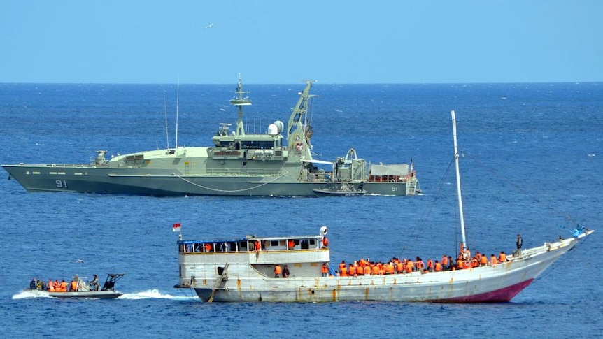 An asylum seeker boat sits in a bay at Christmas Island.