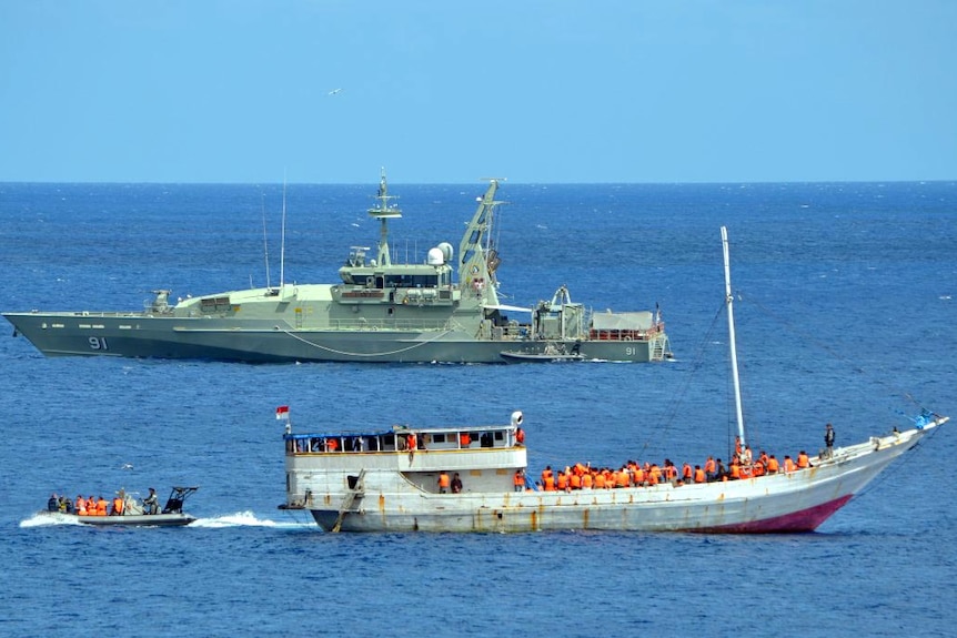 An asylum seeker boat sits in a bay at Christmas Island.