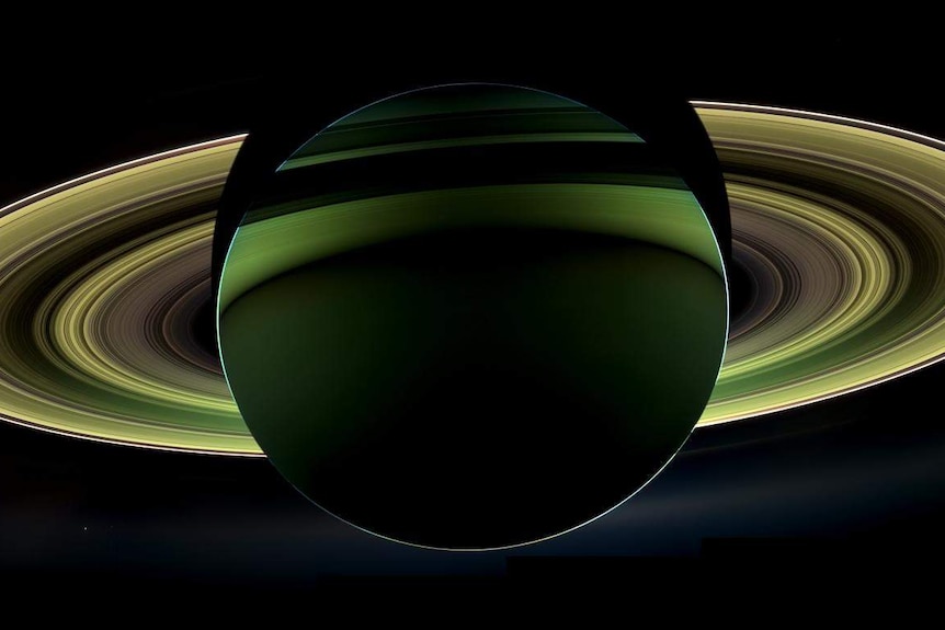 Saturn's rings backlit by the Sun