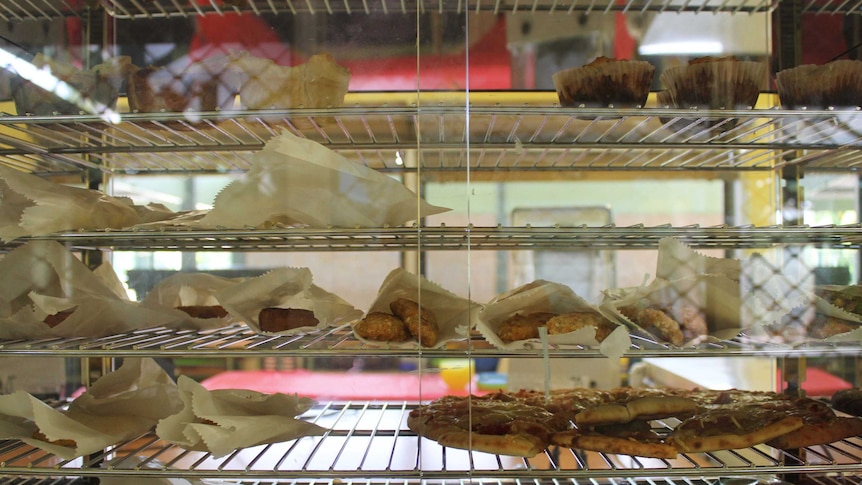 A school's pie oven filled with pies, pastries and other baked goods.