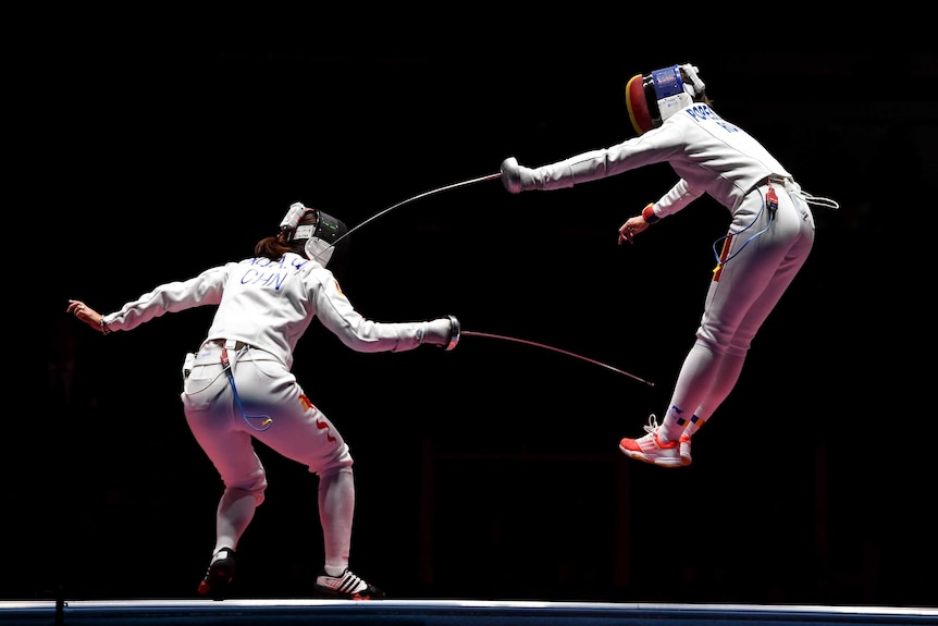 Ana Maria Popescu of Romania competes against Anqi Xu of China during the Women's Epee Team Gold Medal Match in Rio.