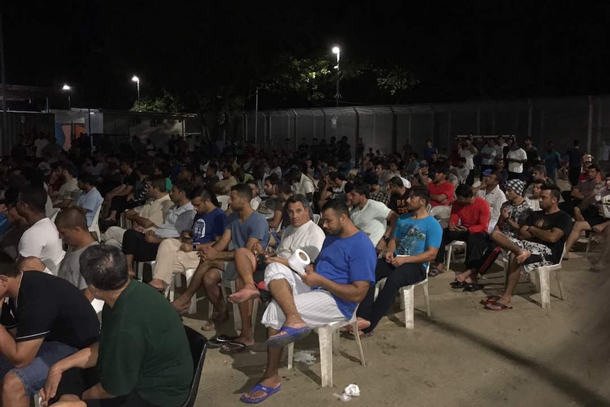 The fellow refugees and asylum seekers gathered in the courtyard