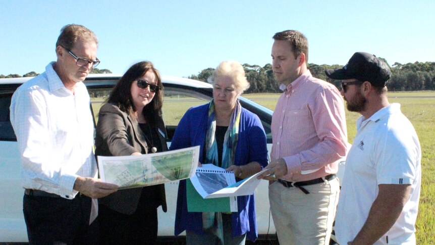 politicians and oysters farmers look at plans for NSW hatchery
