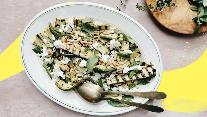 A big plate of grilled zucchini salad with feta, herbs and pine nuts for a collection of summer recipes.