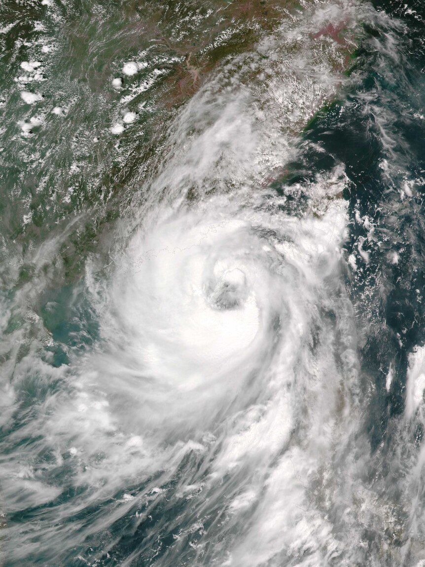 A satellite image shows Typhoon Nida approaching China.