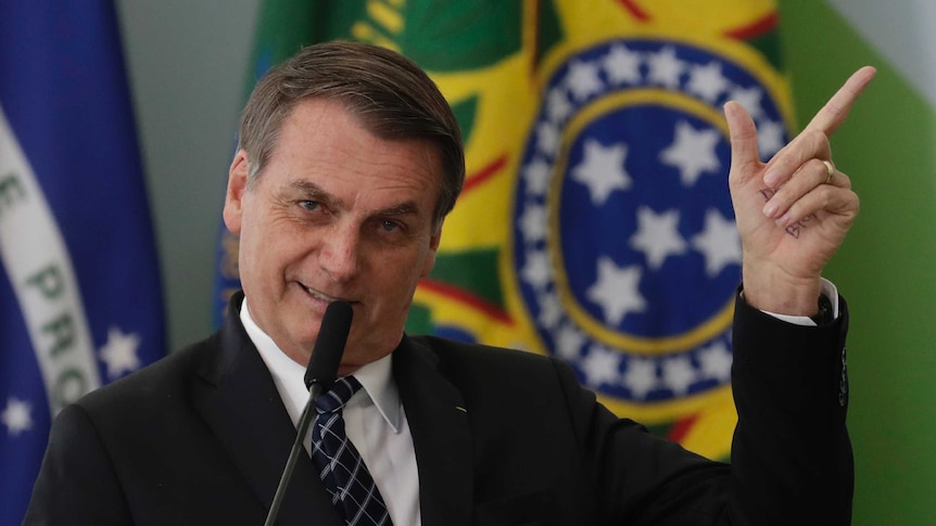 Brazil's President Jair Bolsonaro speaks during the launching ceremony of the Doctors for Brazil Program, at the Planalto Presidential Palace, in Brasilia, Brazil, Thursday, Aug. 1, 2019. According to the government, the Doctors for Brazil Program will replace the program implemented by Former President Dilma Rousseff with the help of Cuban doctors, replacing them with Brazilian doctors.