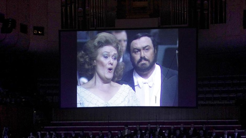 Image of Dame Joan Sutherland and Luciano Pavarotti on screen at memorial service