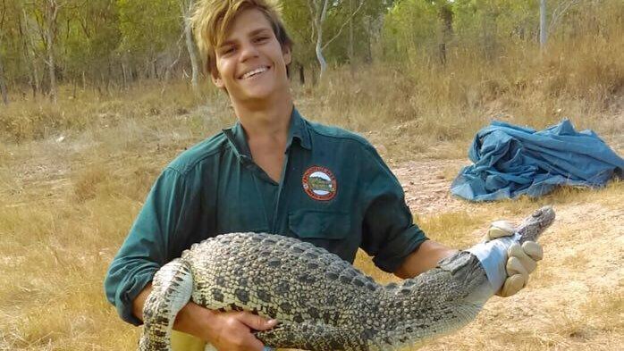 Kenny Peckham with a crocodile at Crocodylus Park.