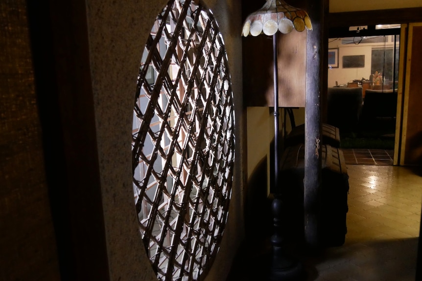 A circular wall window in a dark room